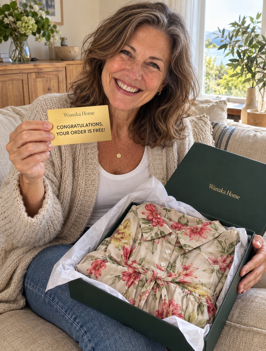 Customer holding a Wanaka Home golden ticket